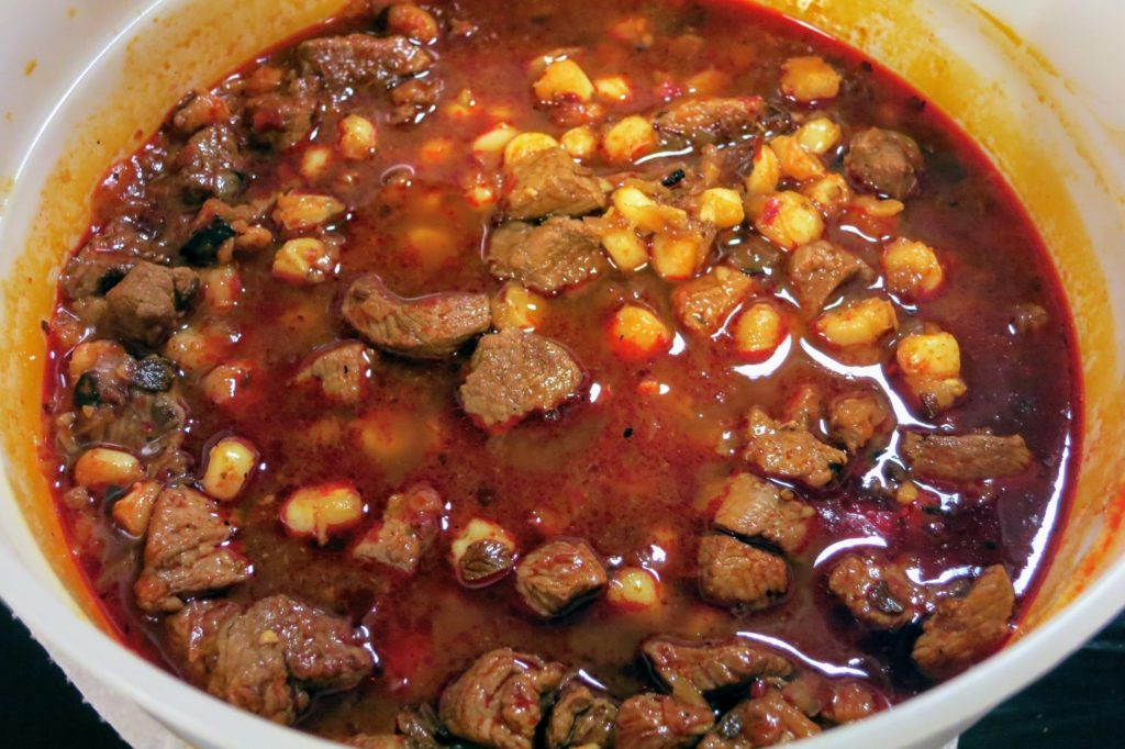 finished posole in a storage container