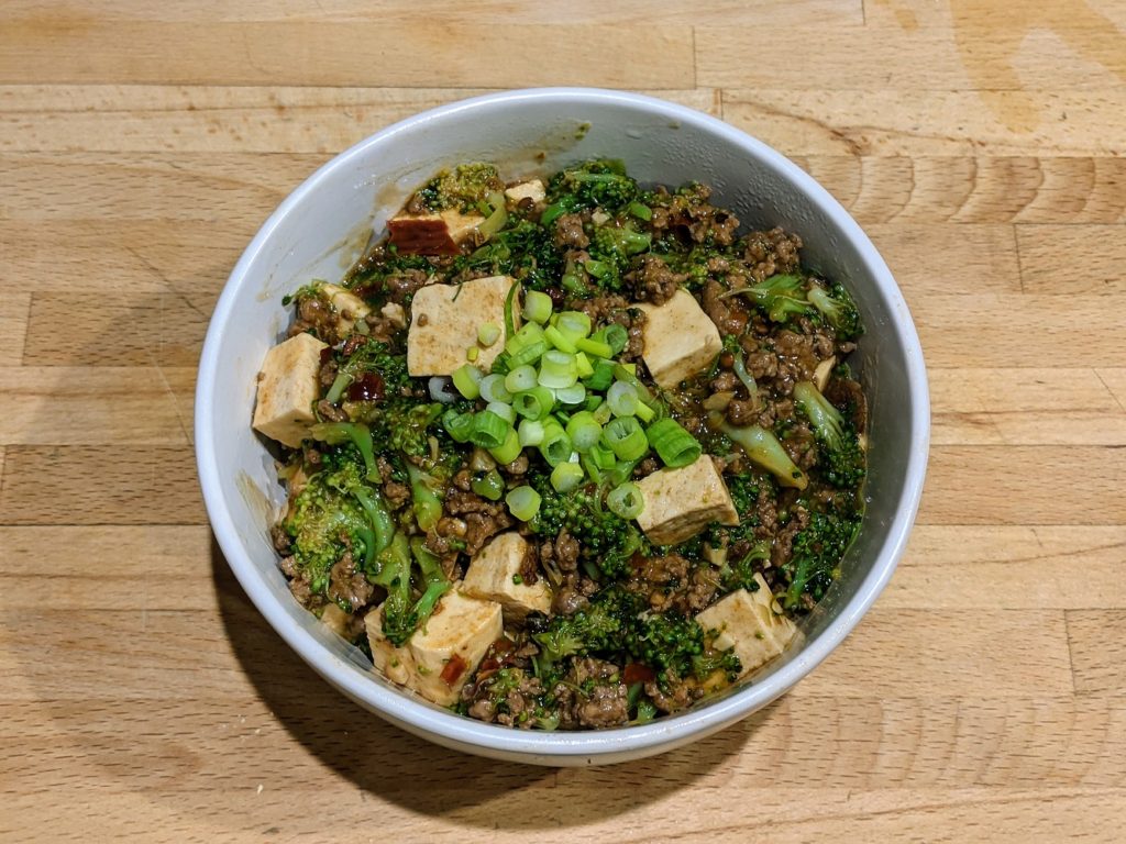 mapo tofu over rice with green onions