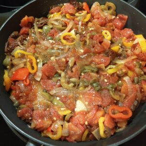 tilapia cooking in vera cruz sauce